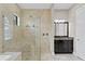 Modern bathroom with a frameless glass shower, double shower heads, and dark wood cabinets at 1903 Haven Bend, Tampa, FL 33613