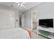 Comfortable bedroom features neutral walls, an ensuite bath, and closet for ample storage at 1903 Haven Bend, Tampa, FL 33613