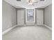 Neutral bedroom featuring carpet, a fan and a sitting area between closets at 1903 Haven Bend, Tampa, FL 33613