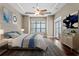 Bright and airy primary bedroom with ceiling fan and french doors at 1903 Haven Bend, Tampa, FL 33613