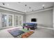 Spacious bonus room features french doors, a lake view, exercise table, and recessed lighting at 1903 Haven Bend, Tampa, FL 33613