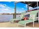 Private dock offers relaxing lake views with comfortable lounge seating and convenient boat access at 1903 Haven Bend, Tampa, FL 33613