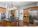 Gourmet kitchen featuring custom cabinets, large island, and stainless steel appliances at 1903 Haven Bend, Tampa, FL 33613