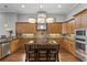 Gourmet kitchen featuring custom cabinets, large island, and high-end appliances at 1903 Haven Bend, Tampa, FL 33613