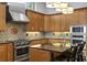 Kitchen featuring granite countertops, stainless steel appliances, and breakfast bar at 1903 Haven Bend, Tampa, FL 33613