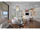 Bright and airy living room with lake views, hardwood floors, and a comfortable seating area for relaxation at 1903 Haven Bend, Tampa, FL 33613