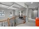 Open upstairs landing featuring coffered ceilings, built-in bookshelves, and natural light at 1903 Haven Bend, Tampa, FL 33613