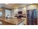 Bright kitchen with stainless steel appliances, granite counters, and white cabinets at 200 4Th S Ave # 139, St Petersburg, FL 33701