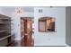 View of the kitchen from the living room with hardwood floors and recessed lighting at 200 4Th S Ave # 139, St Petersburg, FL 33701