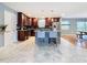 This well-lit kitchen features granite countertops, an island with barstool seating, and stylish fixtures at 2446 Belleair Rd, Clearwater, FL 33764