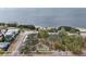 Aerial view of a park near the water, showing lush greenery and open space for recreation and relaxation at 363 Sanctuary Dr, Crystal Beach, FL 34681