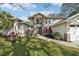 Well maintained home with a brick facade and lush landscaping in the front yard at 363 Sanctuary Dr, Crystal Beach, FL 34681