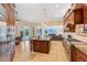 Open kitchen featuring a center island, modern appliances, and a view of the outdoor pool and patio at 363 Sanctuary Dr, Crystal Beach, FL 34681