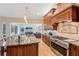 The gourmet kitchen features custom cabinets, a center island, and chef-grade appliances at 363 Sanctuary Dr, Crystal Beach, FL 34681