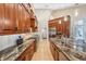Spacious kitchen with granite countertops, stainless steel appliances, and custom cabinets offering ample storage at 363 Sanctuary Dr, Crystal Beach, FL 34681
