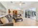 Open concept living room showcases neutral tones, a spacious layout, and seamless flow to the kitchen and outdoor spaces at 363 Sanctuary Dr, Crystal Beach, FL 34681