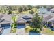Aerial view of the house showing the backyard, landscaping, and surrounding neighborhood at 714 Sugar Camp Way, Brooksville, FL 34604