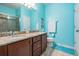 Well-lit bathroom features double sinks, granite countertops, and updated fixtures at 714 Sugar Camp Way, Brooksville, FL 34604