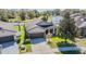 Beautiful home features manicured landscaping, large trees, and a spacious driveway at 714 Sugar Camp Way, Brooksville, FL 34604