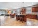 Open-concept kitchen with modern appliances, granite countertops, and a central island at 714 Sugar Camp Way, Brooksville, FL 34604