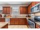 Well-equipped kitchen features granite countertops, stainless steel appliances, and ample cabinet space at 714 Sugar Camp Way, Brooksville, FL 34604