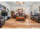 Comfortable living room with hardwood floors and ample seating for entertaining at 714 Sugar Camp Way, Brooksville, FL 34604