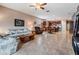 Spacious open-concept living area seamlessly connects to the kitchen and dining room at 714 Sugar Camp Way, Brooksville, FL 34604