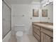 Bright bathroom with a shower, toilet, and vanity with updated fixtures at 8005 Bardmoor Pl # 202I, Seminole, FL 33777