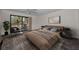 Bright bedroom with a ceiling fan and sliding glass doors leading to the outside at 8005 Bardmoor Pl # 202I, Seminole, FL 33777