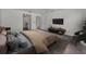 Stylized bedroom features a ceiling fan, comfortable furniture, and neutral colors at 8005 Bardmoor Pl # 202I, Seminole, FL 33777