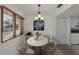 Cozy breakfast nook with large window, providing a charming dining space and great natural light at 8005 Bardmoor Pl # 202I, Seminole, FL 33777