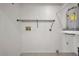 A clean laundry room with shelving, washer hookup, and a modern water heater at 8005 Bardmoor Pl # 202I, Seminole, FL 33777