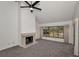 Bright living room featuring fireplace, vaulted ceilings, open floor plan, and large windows at 8005 Bardmoor Pl # 202I, Seminole, FL 33777