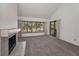 Bright open living room with fireplace and large window with a sliding door to balcony at 8005 Bardmoor Pl # 202I, Seminole, FL 33777