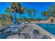 A shaded outdoor patio with seating near the pool area offers a perfect spot for relaxation at 8005 Bardmoor Pl # 202I, Seminole, FL 33777
