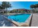 A rectangular community pool offers a refreshing retreat under the bright sun at 8005 Bardmoor Pl # 202I, Seminole, FL 33777
