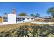 Back of house featuring the swimming pool, chimney, and screened in porch at 8418 Flagstone Dr, Tampa, FL 33615