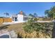 Landscaped backyard with mature citrus tree and screened in porch at 8418 Flagstone Dr, Tampa, FL 33615