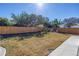 Large fenced backyard with mature trees and patio area at 8418 Flagstone Dr, Tampa, FL 33615