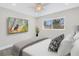 Bedroom with large window, ceiling fan, and television at 8418 Flagstone Dr, Tampa, FL 33615
