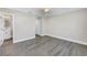 Bedroom with entry to ensuite bath, closet, ceiling fan, and wood-style floors at 8418 Flagstone Dr, Tampa, FL 33615