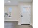 Inviting entryway features a window and white front door with glass panels at 8418 Flagstone Dr, Tampa, FL 33615