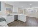 Open kitchen with white cabinets, marble countertops, and stainless steel dishwasher at 8418 Flagstone Dr, Tampa, FL 33615