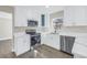 Modern kitchen with stainless steel appliances, white cabinetry, and stylish countertops at 8418 Flagstone Dr, Tampa, FL 33615
