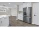 Bright kitchen with white cabinets, quartz countertops, stainless steel appliances, and luxury vinyl flooring at 8418 Flagstone Dr, Tampa, FL 33615