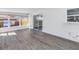 Bright sunroom features luxury vinyl floors, lots of natural light, a sliding glass door, and multiple windows at 8418 Flagstone Dr, Tampa, FL 33615