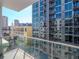 A balcony view showcases the city skyline and nearby building architecture from a high-rise condo complex at 111 N 12Th St # 1619, Tampa, FL 33602