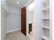 Walk-in closet leading to a bathroom with a soaking tub at 111 N 12Th St # 1619, Tampa, FL 33602