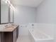 Bright bathroom with dual sinks and tub at 111 N 12Th St # 1619, Tampa, FL 33602