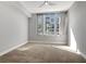 Bedroom with a ceiling fan and large window allowing natural light at 111 N 12Th St # 1619, Tampa, FL 33602